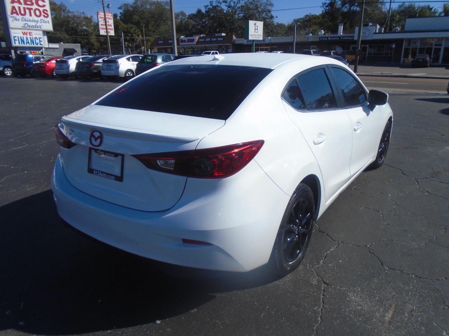 2014 Mazda MAZDA3 (JM1BM1V72E1) , located at 6112 N Florida Avenue, Tampa, FL, 33604, (888) 521-5131, 27.954929, -82.459534 - Photo#4